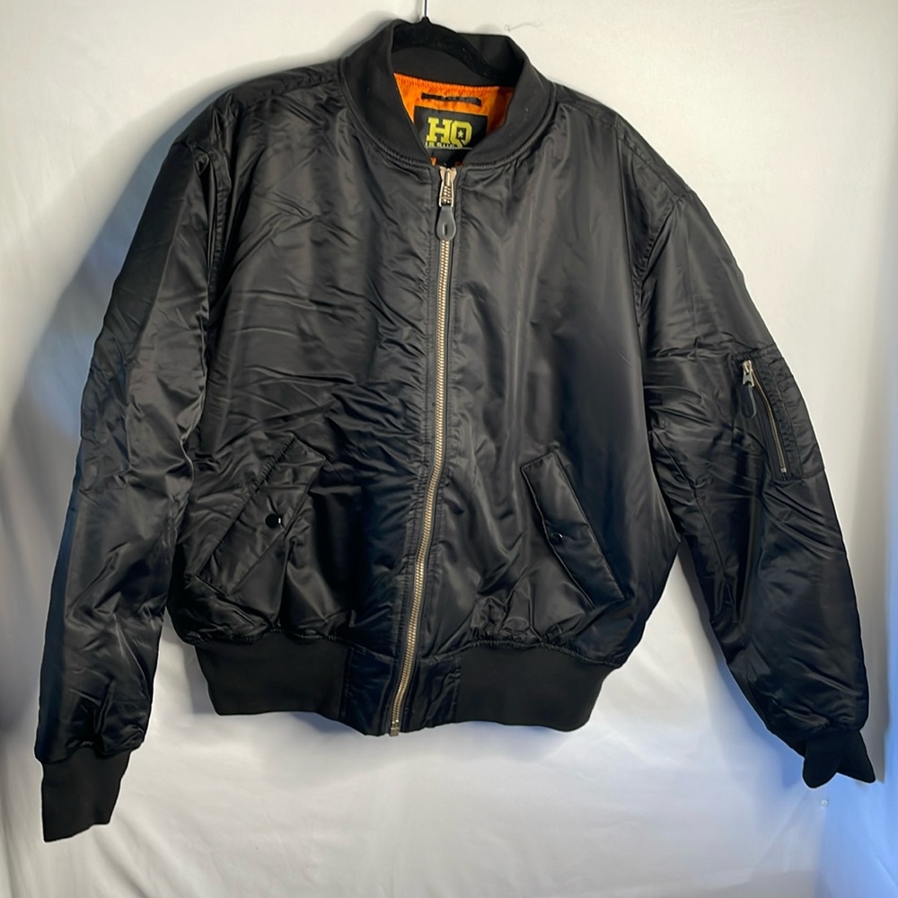 Hq is sue puffer jacket size large black with orange inside lineing pockets